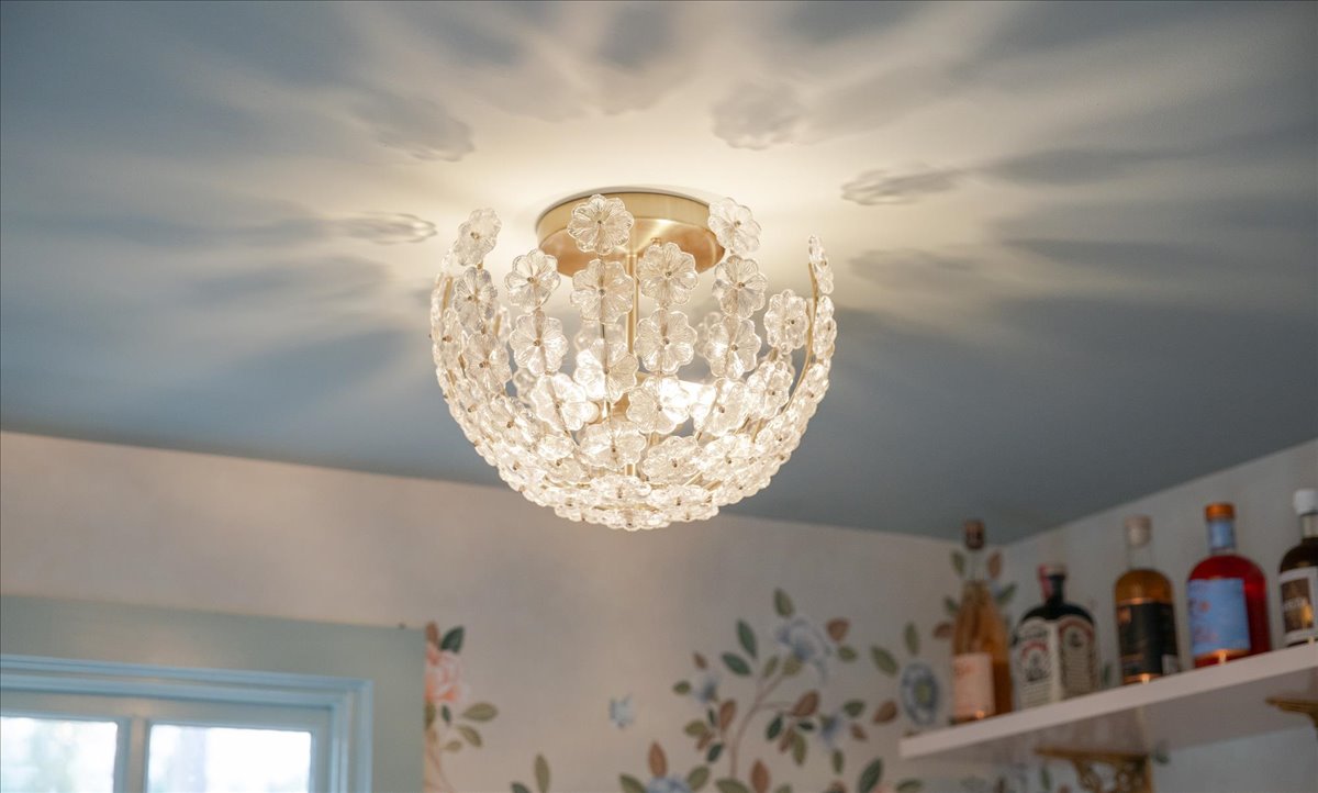Ceiling light and blue ceiling above open kitchenette shelves