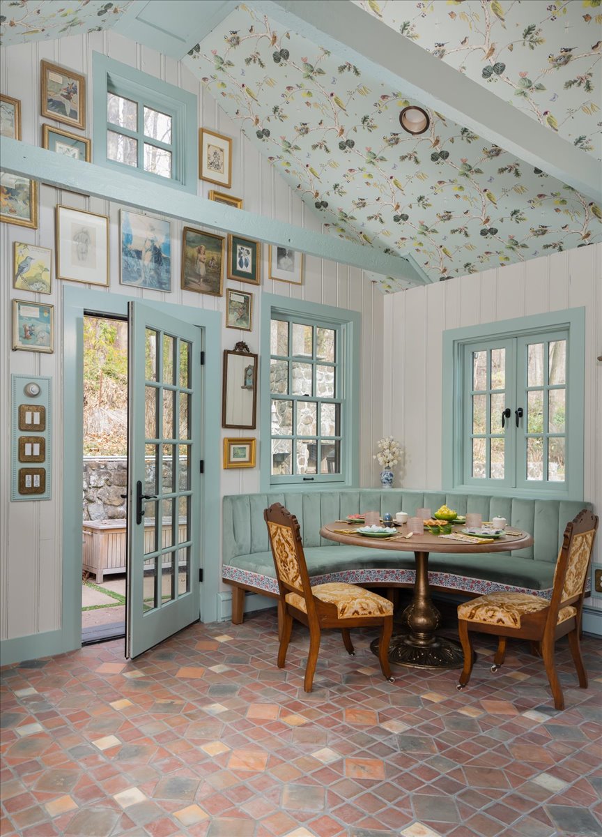 Dining nook with built-in seating and patterned ceiling
