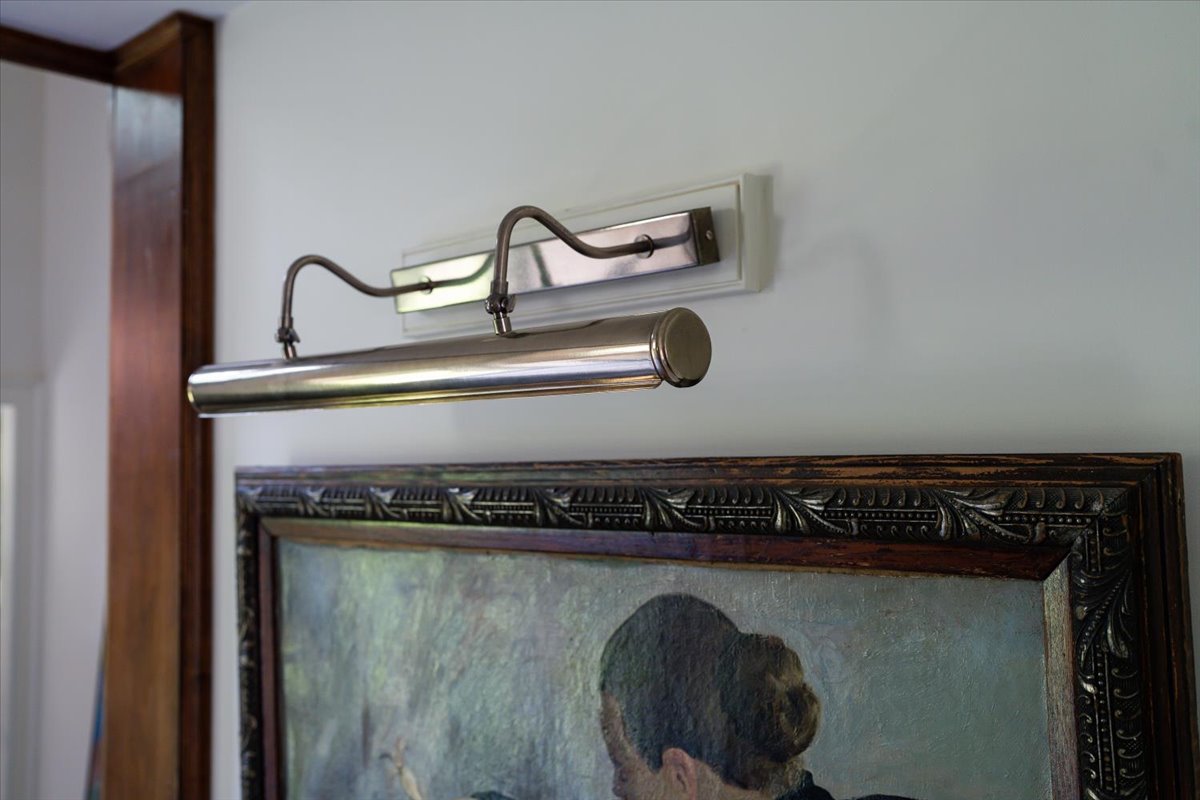 Gallery House furnished room with artwork and natural light