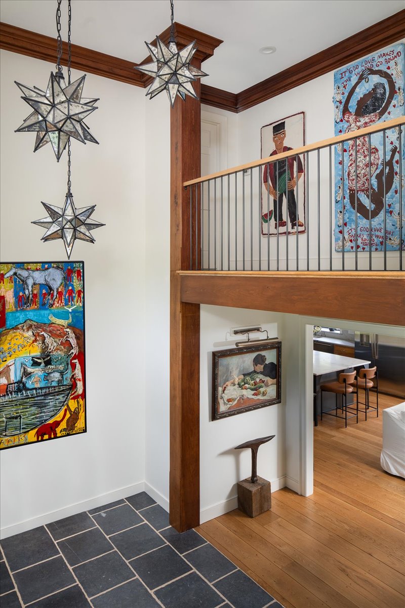 Gallery House vertical detail with warm finishes and artwork