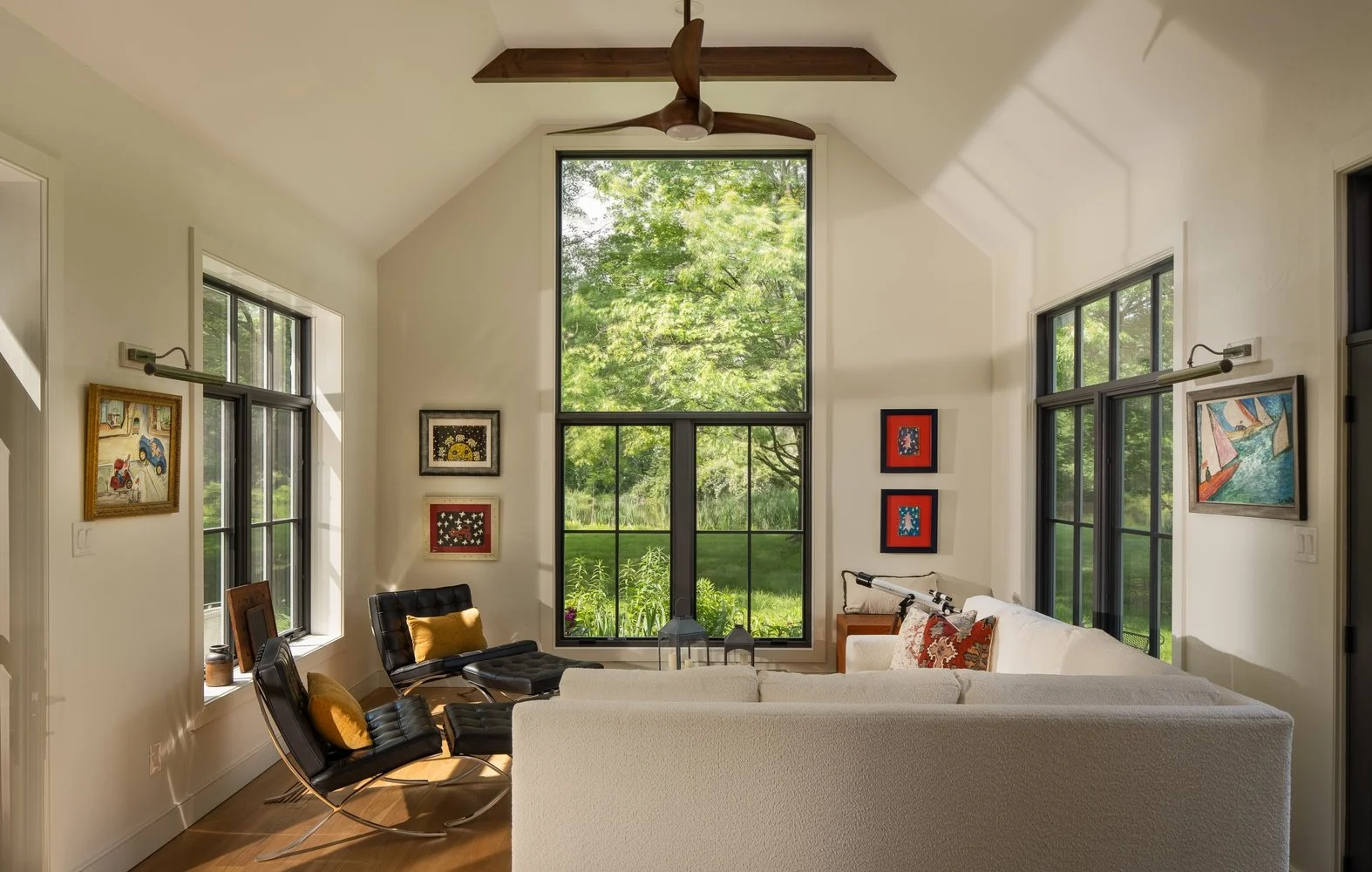 Open living and dining room with custom fireplace and natural textures